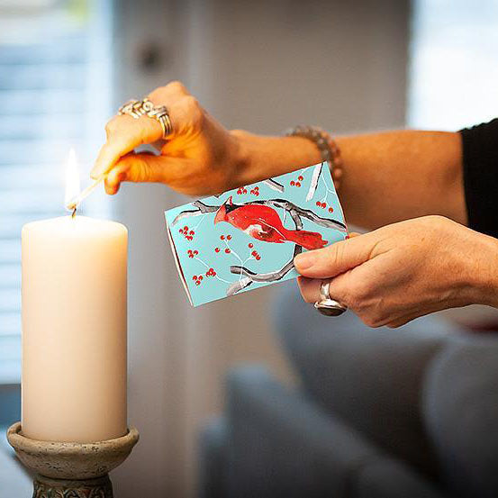 Cardinal print matches box and match lighting candle